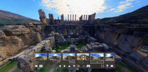 This is a screenshot of a virtual reality tour of Iraq Al Amir, an ancient archaeological site in Jordan, displayed on a screen with immersive and interactive visuals showcasing historic ruins, demonstrating the Jordan Tourism Board’s use of VR technology to enhance visitor engagement.